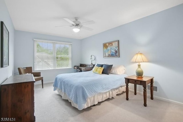 bedroom with carpet, baseboards, and a ceiling fan