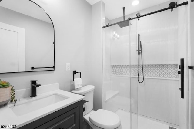 19 Village Way Unit 7H, Vernon Twp, NJ 07462 - bathroom featuring a shower stall, toilet, and vanity