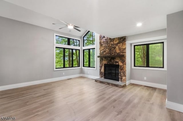 19 Village Way Unit 7H, Vernon Twp, NJ 07462 - unfurnished living room with plenty of natural light, baseboards, ceiling fan, a fireplace, and lofted ceiling