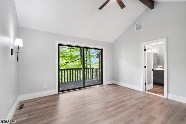 19 Village Way Unit 7H, Vernon Twp, NJ 07462 - unfurnished bedroom featuring access to exterior, beam ceiling, wood finished floors, high vaulted ceiling, and baseboards