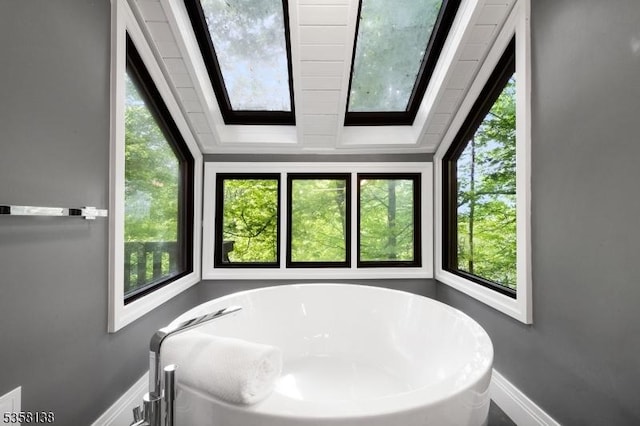 19 Village Way Unit 7H, Vernon Twp, NJ 07462 - full bathroom featuring baseboards, a soaking tub, and plenty of natural light