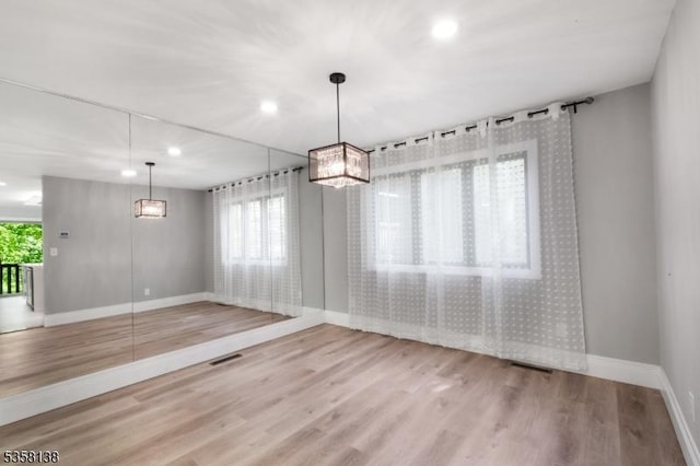 19 Village Way Unit 7H, Vernon Twp, NJ 07462 - unfurnished dining area featuring baseboards, wood finished floors, and recessed lighting