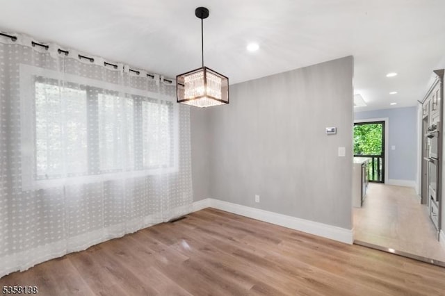 19 Village Way Unit 7H, Vernon Twp, NJ 07462 - unfurnished dining area featuring wood finished floors, baseboards, and recessed lighting