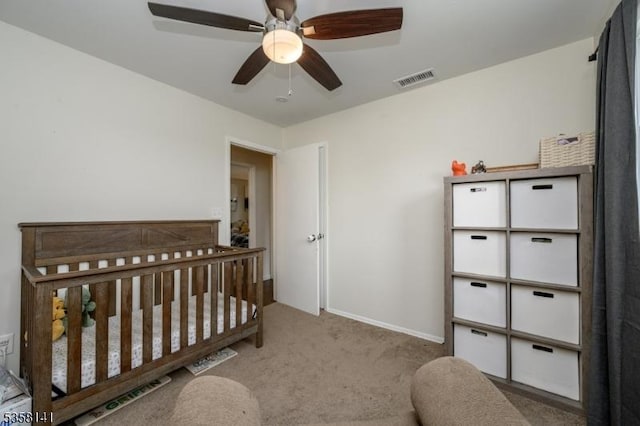 bedroom featuring carpet, a ceiling fan, and baseboards