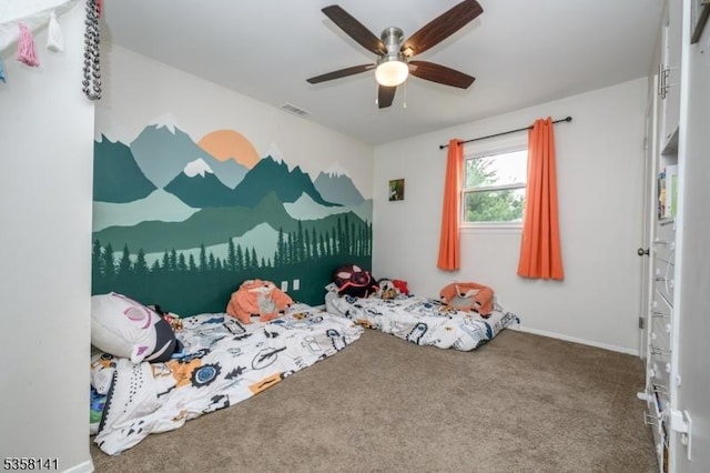 bedroom featuring carpet flooring, a ceiling fan, and baseboards