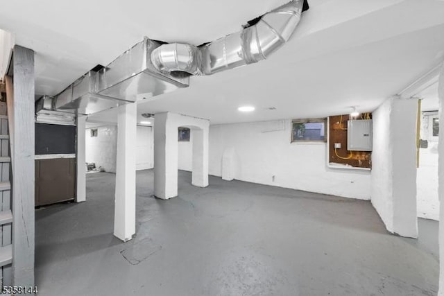 basement featuring electric panel