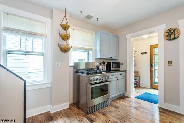 132 Linden Ave, Glen Ridge Boro Twp, NJ 07028 - kitchen with appliances with stainless steel finishes, light wood-type flooring, baseboards, and dark countertops
