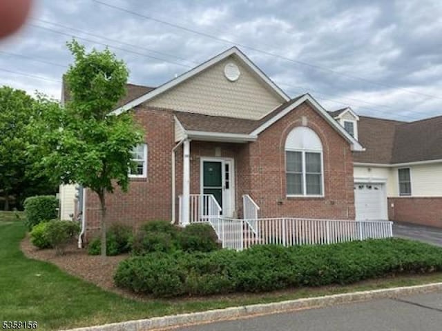 109 Samson Dr, Raritan Twp, NJ 08822 - view of front facade featuring brick siding, a garage, and driveway