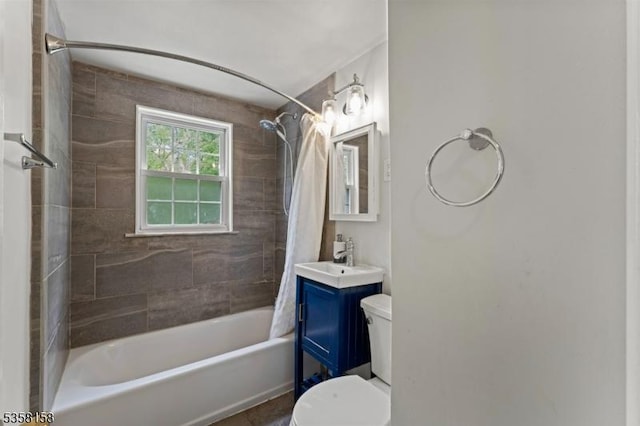 full bathroom featuring toilet, shower / tub combo, and vanity