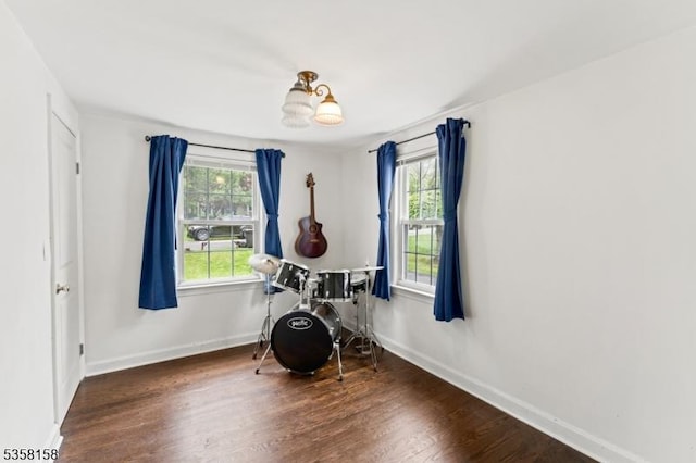 misc room with wood finished floors and baseboards