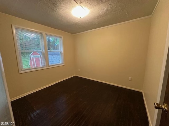 7 Cleveland Ave, Victory Gardens Boro, NJ 07801 - unfurnished room featuring a textured ceiling, dark wood-type flooring, baseboards, and crown molding