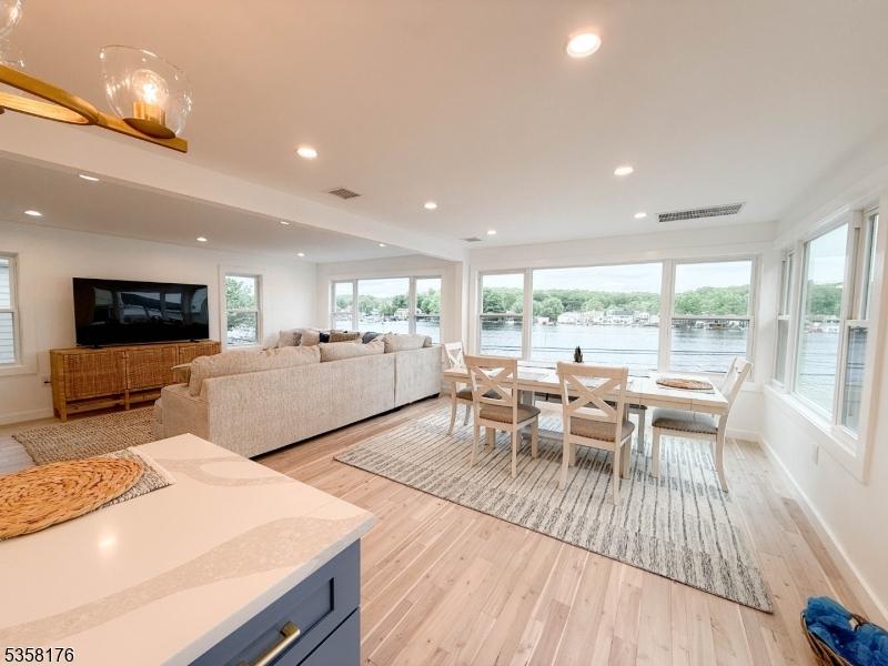 35 S Lakeside Ave, Jefferson Twp, NJ 07849 - dining room with light wood-style flooring, a water view, baseboards, and recessed lighting