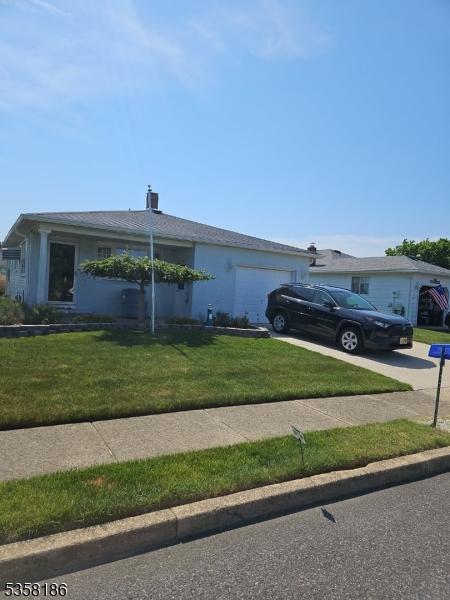 27 Maracaibo Pl, Berkeley Twp, NJ 08757 - ranch-style home with driveway, a garage, and a front yard