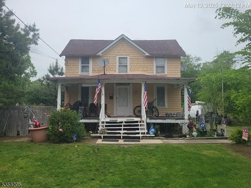 20 Newark Pompton Tpke, Pequannock Twp, NJ 07440 - view of front of home with covered porch and a front yard