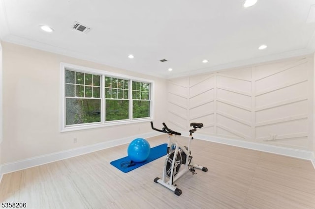 workout room featuring ornamental molding, recessed lighting, and baseboards