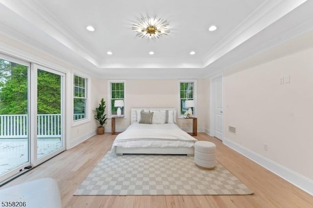 bedroom with a raised ceiling, access to outside, light wood-style floors, crown molding, and recessed lighting