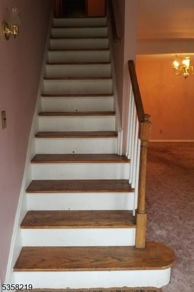 18 Cray Ter, Fanwood Boro, NJ 07023 - stairs featuring carpet, a chandelier, and baseboards
