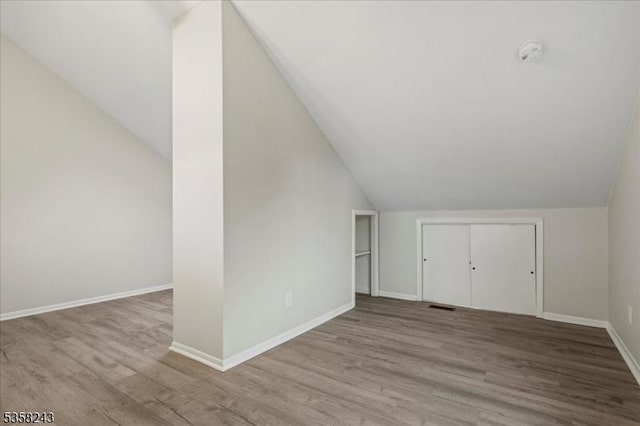 3 Telemark Dr Unit 10, Vernon Twp, NJ 07462 - additional living space with vaulted ceiling, wood finished floors, and baseboards