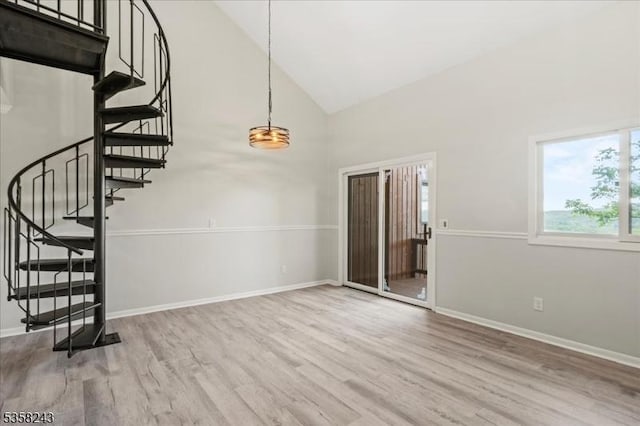 3 Telemark Dr Unit 10, Vernon Twp, NJ 07462 - unfurnished living room featuring high vaulted ceiling, stairs, wood finished floors, and baseboards