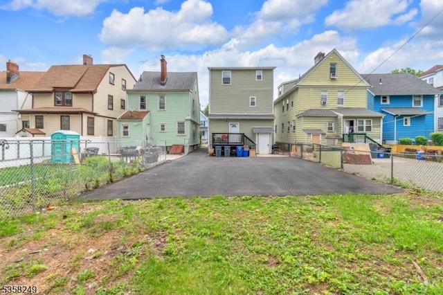 227 N Center St, City Of Orange Twp, NJ 07050 - back of house with a residential view and fence