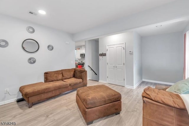 227 N Center St, City Of Orange Twp, NJ 07050 - living area featuring baseboards and light wood finished floors