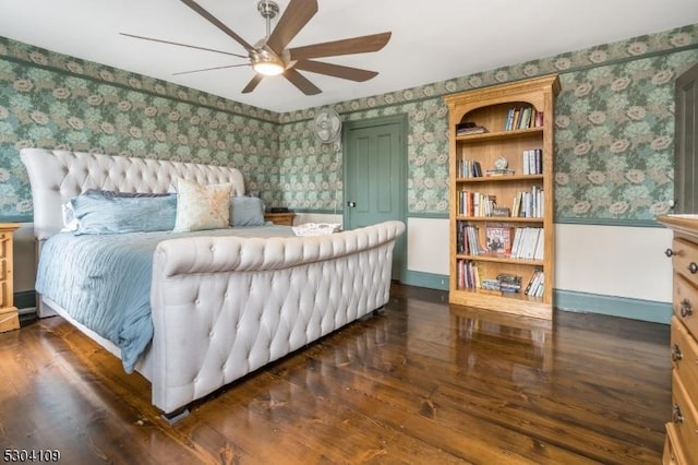 bedroom featuring wallpapered walls, wood finished floors, baseboards, and ceiling fan