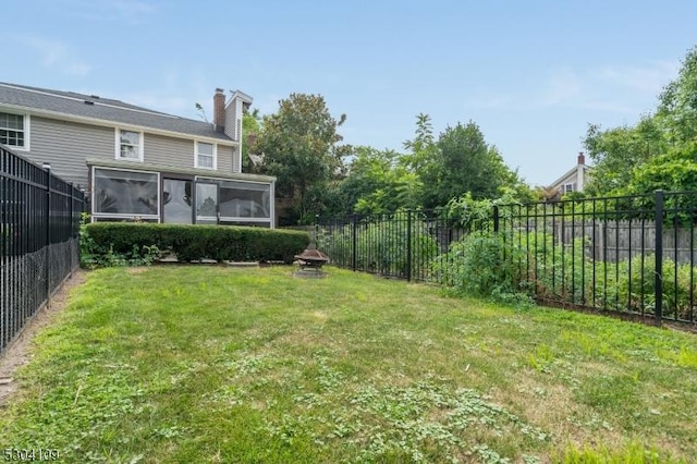 view of yard with a sunroom