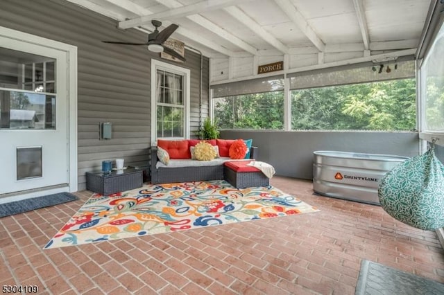 sunroom with an outdoor hangout area, ceiling fan, and beamed ceiling