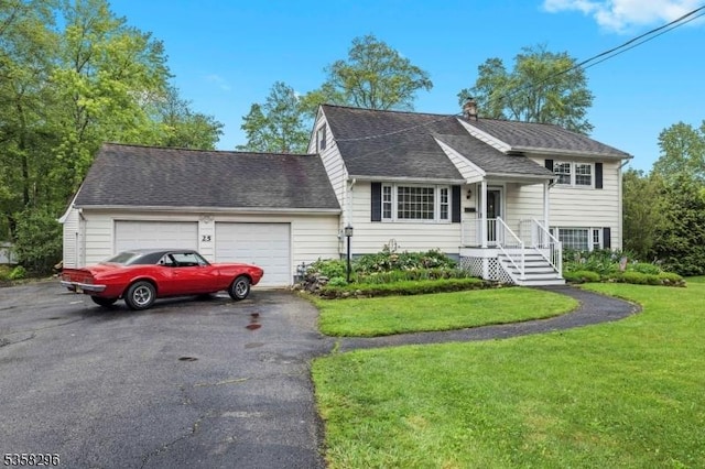 25 Hunter St, Roxbury Twp, NJ 07876 - split level home featuring asphalt driveway, a garage, and a front yard