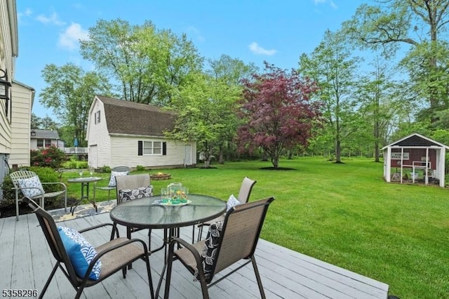 25 Hunter St, Roxbury Twp, NJ 07876 - wooden deck with an outbuilding, a lawn, and outdoor dining area