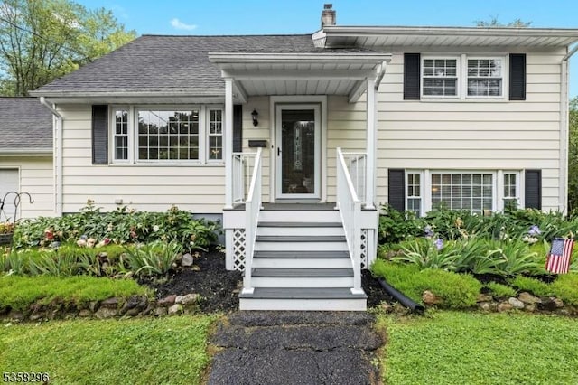 25 Hunter St, Roxbury Twp, NJ 07876 - view of front facade with roof with shingles and a chimney