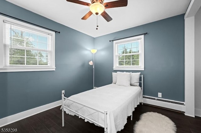 25 Hunter St, Roxbury Twp, NJ 07876 - bedroom with a baseboard heating unit, wood finished floors, and a ceiling fan