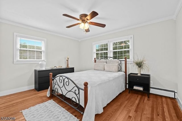 25 Hunter St, Roxbury Twp, NJ 07876 - bedroom with a baseboard radiator, crown molding, multiple windows, wood finished floors, and a ceiling fan