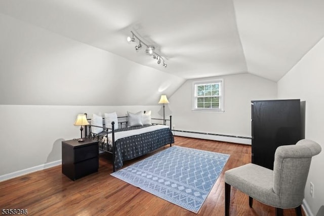25 Hunter St, Roxbury Twp, NJ 07876 - bedroom featuring a baseboard heating unit, wood finished floors, and lofted ceiling