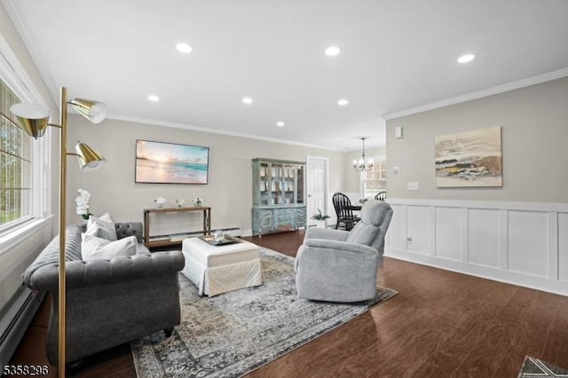 25 Hunter St, Roxbury Twp, NJ 07876 - living room with ornamental molding, a chandelier, wood finished floors, wainscoting, and recessed lighting