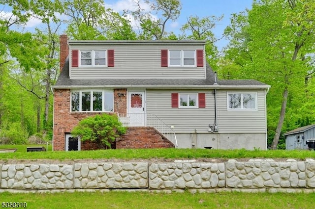 104 Lake Park Ter, West Milford Twp, NJ 07421 - view of front of house featuring a chimney, brick siding, and a shingled roof