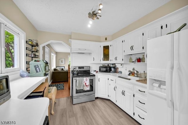 104 Lake Park Ter, West Milford Twp, NJ 07421 - kitchen featuring white refrigerator with ice dispenser, electric stove, a sink, white cabinets, and light wood finished floors