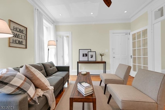 living room featuring wood finished floors, crown molding, recessed lighting, and ceiling fan