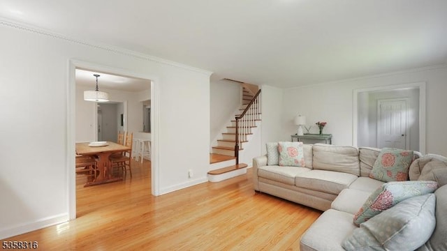 126 Wells St, Westfield Town, NJ 07090 - living area with light wood finished floors, stairs, baseboards, and ornamental molding