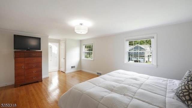 126 Wells St, Westfield Town, NJ 07090 - bedroom featuring multiple windows, light wood-type flooring, and baseboards