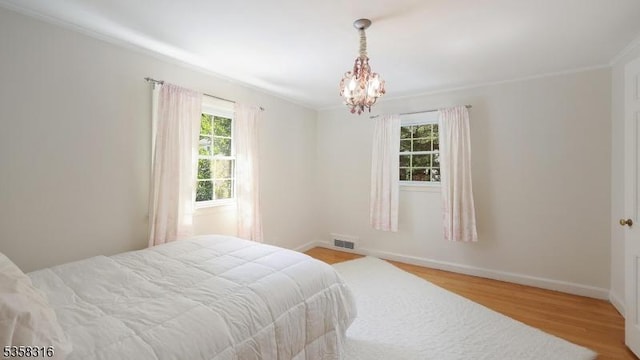 126 Wells St, Westfield Town, NJ 07090 - bedroom featuring wood finished floors, a chandelier, and baseboards