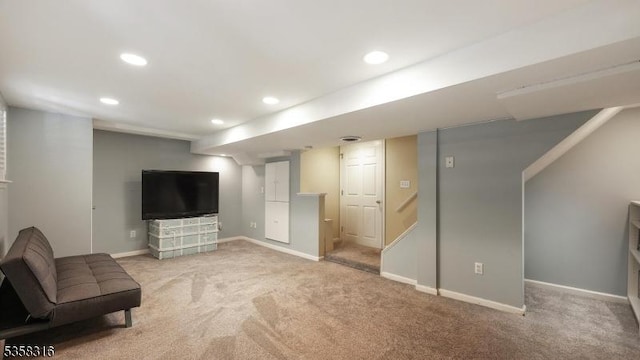 126 Wells St, Westfield Town, NJ 07090 - finished below grade area with light carpet, recessed lighting, baseboards, and stairway