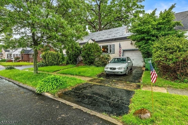 801 Clark St, Linden City, NJ 07036 - view of front facade featuring asphalt driveway and a garage