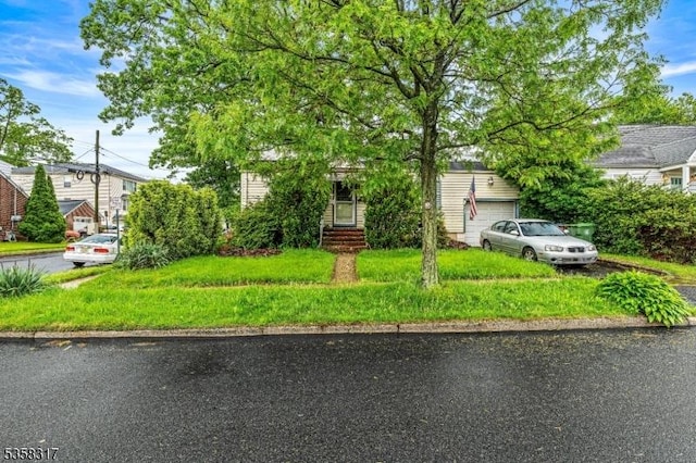 801 Clark St, Linden City, NJ 07036 - view of property hidden behind natural elements with asphalt driveway and an attached garage