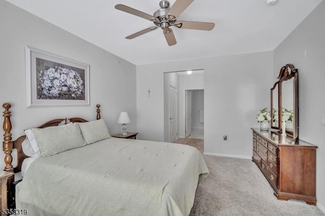 2303 Ambassador Ct Unit 2303, Franklin Twp, NJ 08873 - bedroom featuring light carpet, baseboards, ensuite bathroom, and a ceiling fan