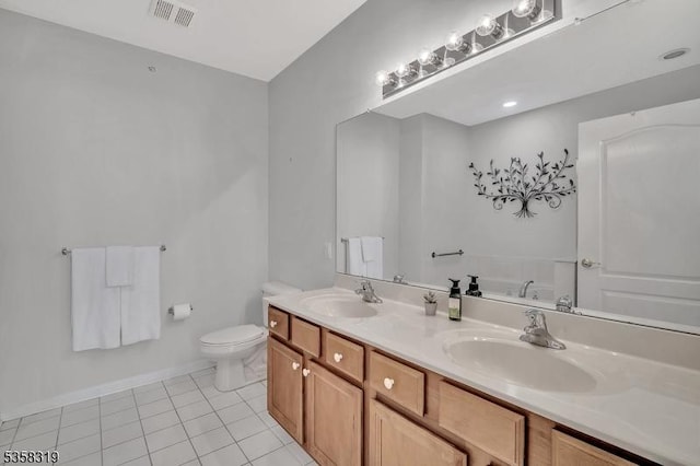 2303 Ambassador Ct Unit 2303, Franklin Twp, NJ 08873 - bathroom with double vanity, toilet, tile patterned flooring, a bath, and baseboards