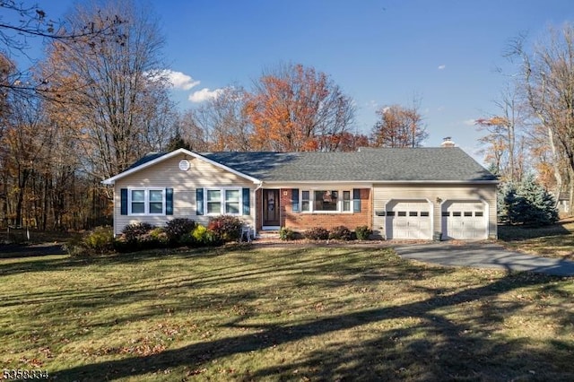 ranch-style house featuring a garage, a chimney, asphalt driveway, a front lawn, and brick siding