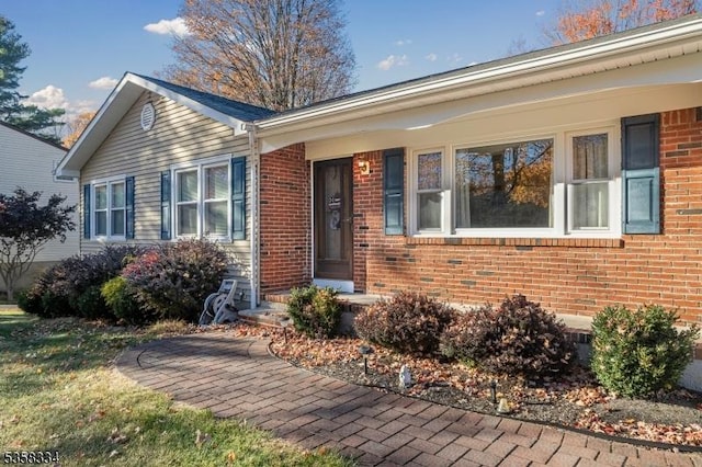 view of front of home with brick siding