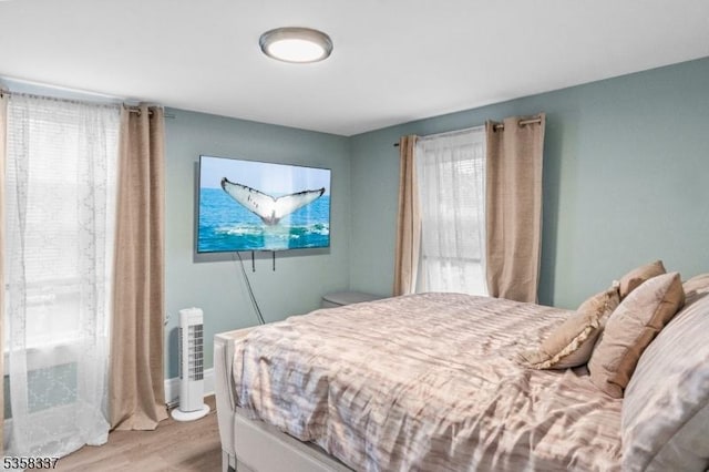 bedroom with light wood-style floors