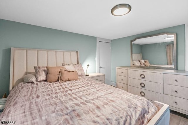bedroom with wood finished floors